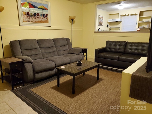 living area with tile patterned floors