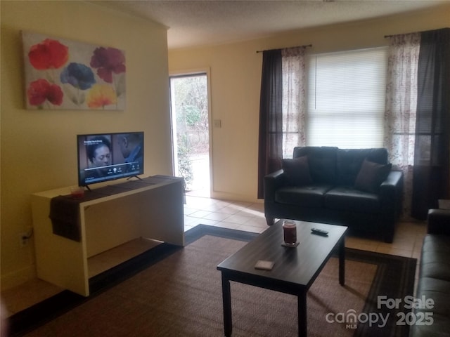 living area with light tile patterned floors