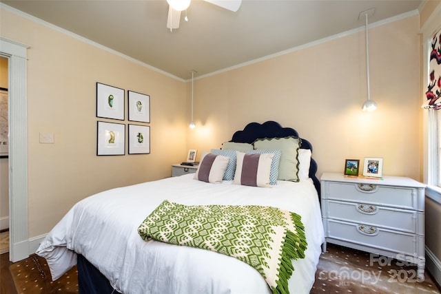 bedroom featuring baseboards, ornamental molding, and a ceiling fan