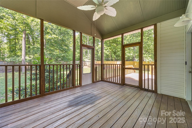 unfurnished sunroom with ceiling fan and lofted ceiling