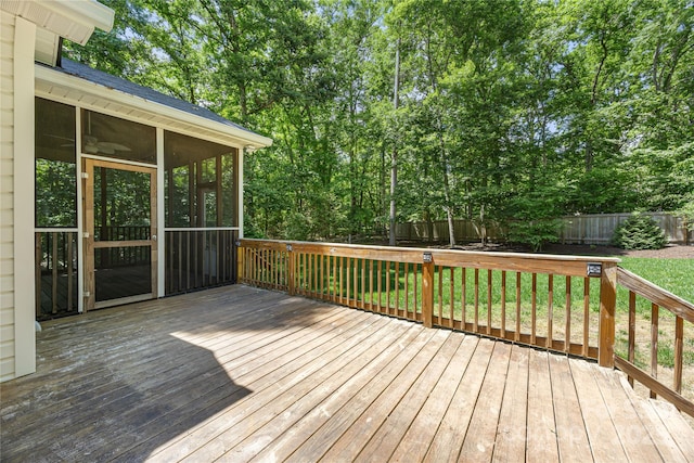 wooden deck featuring a sunroom