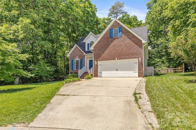 traditional home with brick siding, concrete driveway, and a garage