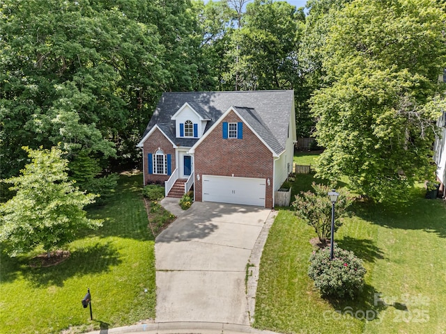 traditional-style house featuring brick siding, driveway, and a front yard