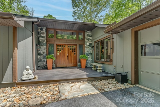 property entrance with stone siding
