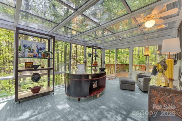 sunroom / solarium with ceiling fan