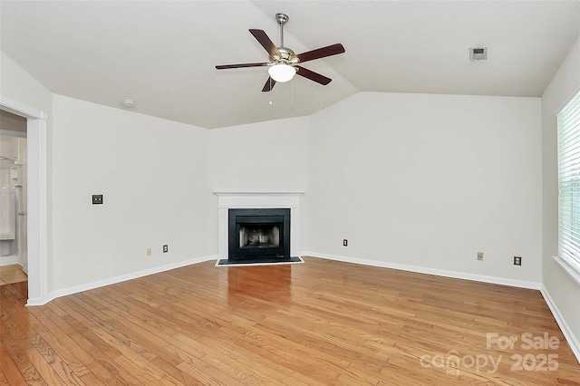 9232 Four Mile Creek Rd, Charlotte, NC 28277 - unfurnished living room with lofted ceiling, a fireplace, light wood-style floors, baseboards, and ceiling fan