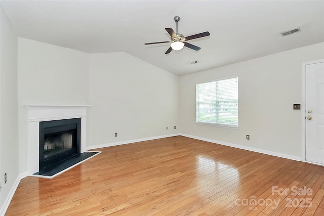9232 Four Mile Creek Rd, Charlotte, NC 28277 - unfurnished living room featuring ceiling fan, visible vents, a fireplace, vaulted ceiling, and light wood finished floors