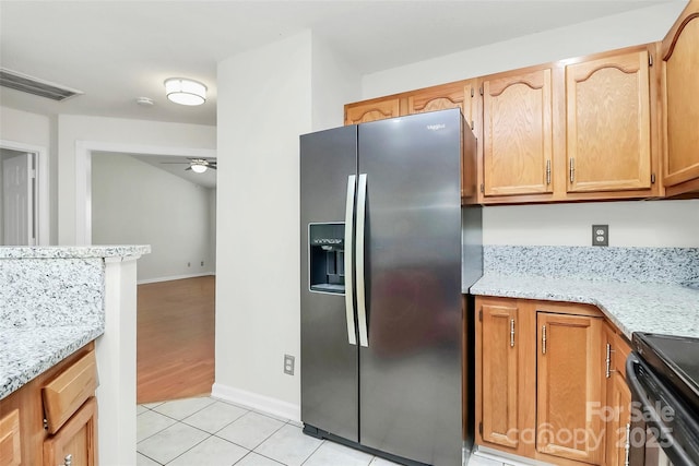 9232 Four Mile Creek Rd, Charlotte, NC 28277 - kitchen with visible vents, light tile patterned flooring, stainless steel refrigerator with ice dispenser, a ceiling fan, and black / electric stove