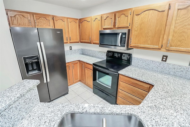 9232 Four Mile Creek Rd, Charlotte, NC 28277 - kitchen with appliances with stainless steel finishes, light tile patterned floors, and light stone countertops