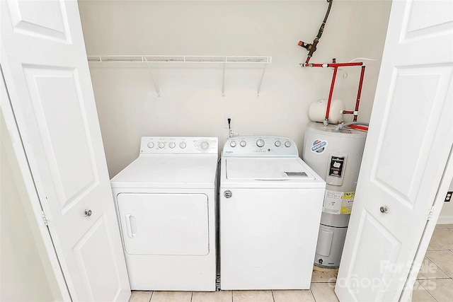 9232 Four Mile Creek Rd, Charlotte, NC 28277 - laundry room with separate washer and dryer, laundry area, light tile patterned floors, and electric water heater