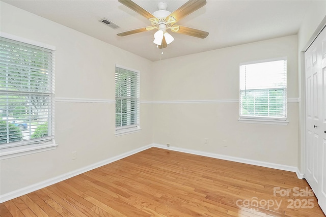 9232 Four Mile Creek Rd, Charlotte, NC 28277 - empty room featuring baseboards, visible vents, a healthy amount of sunlight, and light wood-style flooring