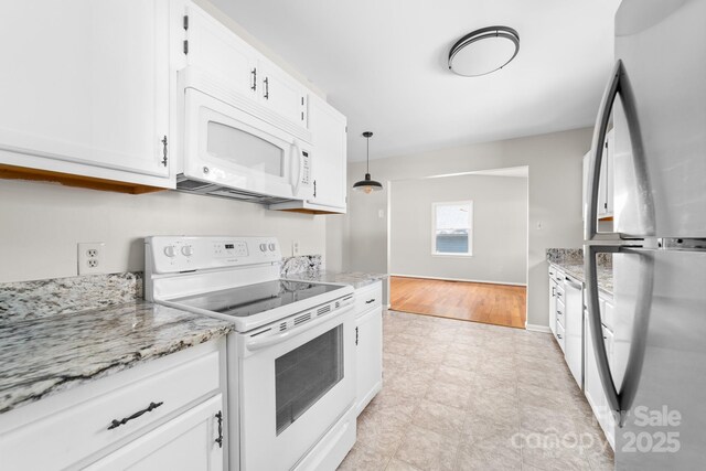 kitchen with light stone counters, pendant lighting, white cabinetry, and white appliances