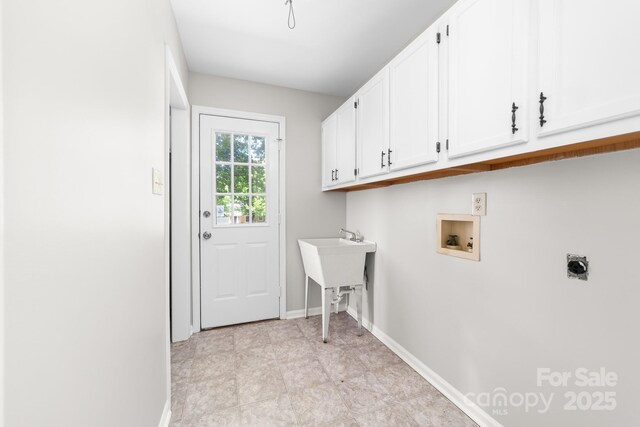 laundry room with baseboards, cabinet space, washer hookup, and hookup for an electric dryer
