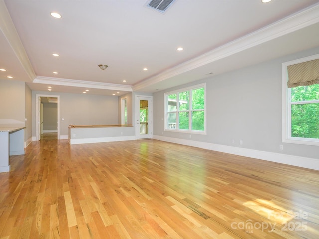 7324 Leharne Dr, Charlotte, NC 28270 - unfurnished living room featuring baseboards, ornamental molding, light wood finished floors, and visible vents