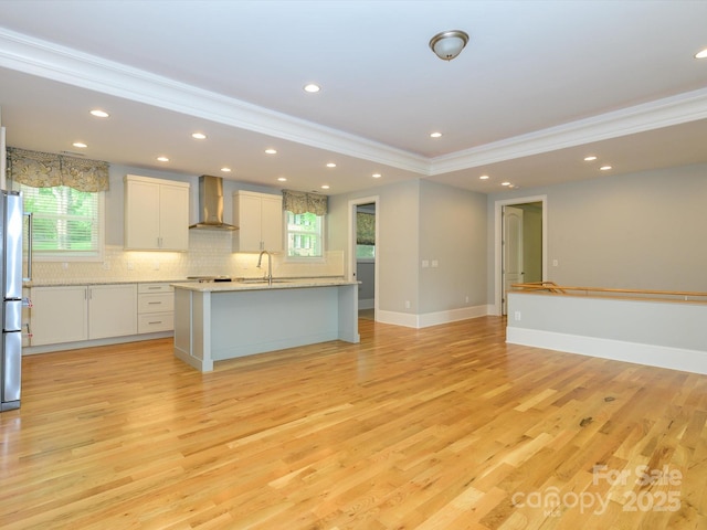 7324 Leharne Dr, Charlotte, NC 28270 - kitchen featuring wall chimney range hood, crown molding, plenty of natural light, and tasteful backsplash
