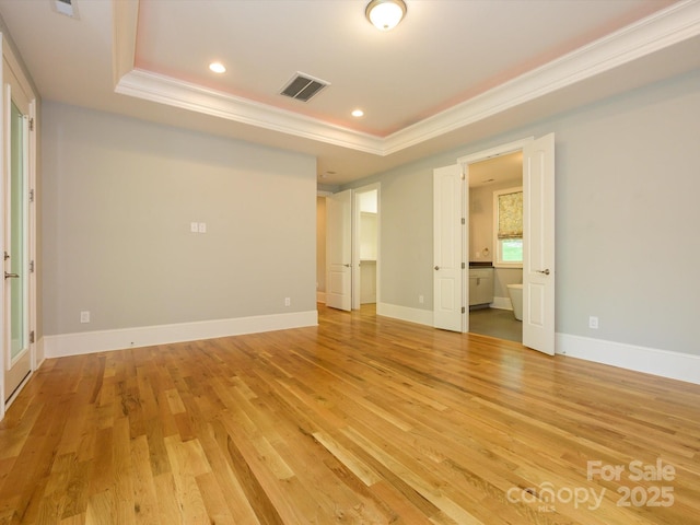 7324 Leharne Dr, Charlotte, NC 28270 - interior space featuring light wood-style floors, a raised ceiling, ornamental molding, and visible vents