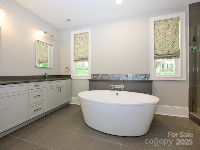 7324 Leharne Dr, Charlotte, NC 28270 - full bath with tile patterned floors, baseboards, vanity, and visible vents