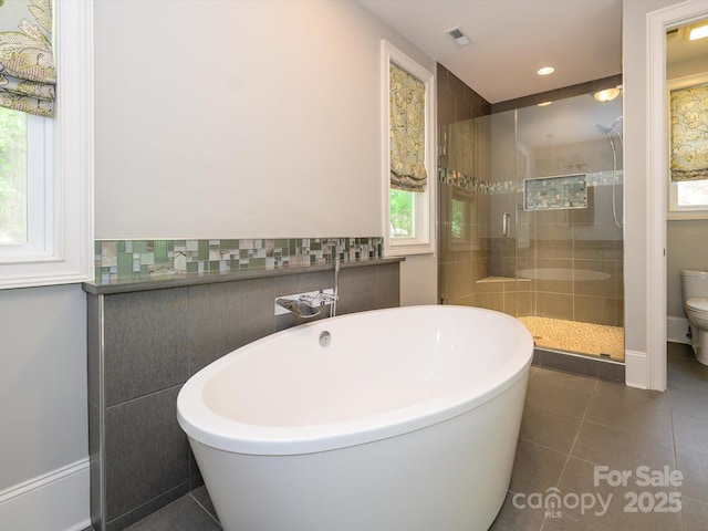 7324 Leharne Dr, Charlotte, NC 28270 - full bathroom featuring visible vents, a shower stall, toilet, a soaking tub, and recessed lighting
