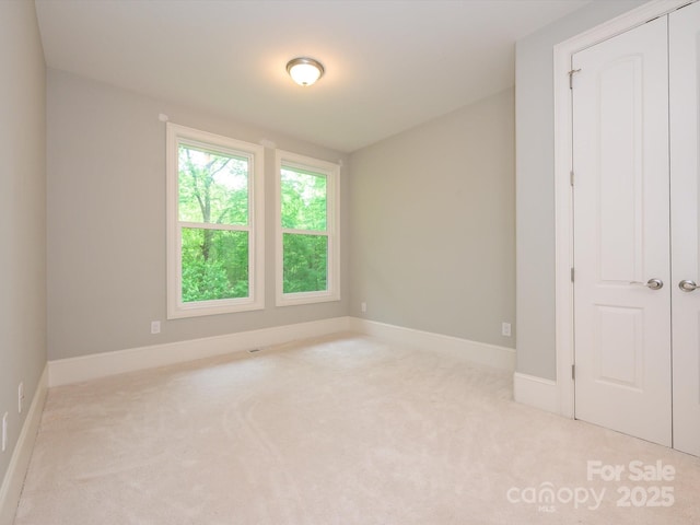 7324 Leharne Dr, Charlotte, NC 28270 - unfurnished bedroom with baseboards and carpet flooring