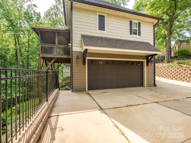 7324 Leharne Dr, Charlotte, NC 28270 - view of front of property featuring fence, a shingled roof, a sunroom, and a garage
