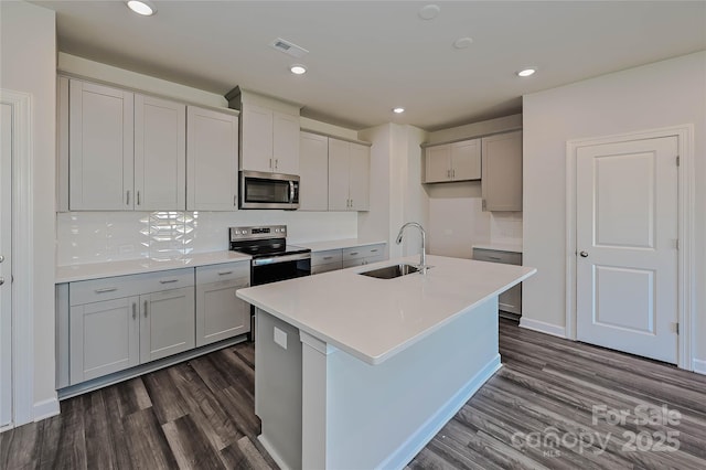 1350 31st St, Conover, NC 28613 - kitchen featuring stainless steel appliances, visible vents, dark wood-style floors, and a sink