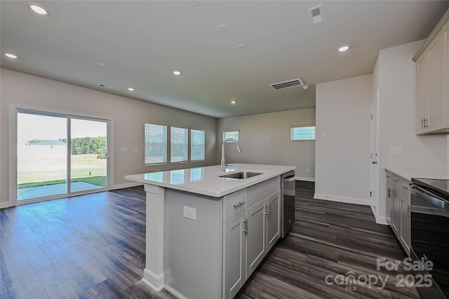 kitchen with visible vents, dark wood finished floors, dishwasher, a sink, and black range with electric cooktop