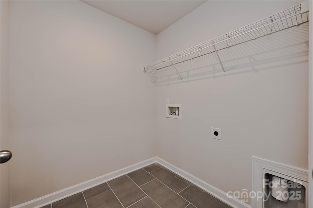 laundry area with hookup for an electric dryer, laundry area, baseboards, and hookup for a washing machine