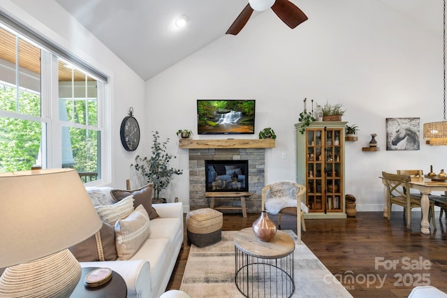 9 Oak Mountain Dr, Leicester, NC 28748 - living area with wood finished floors, ceiling fan, high vaulted ceiling, baseboards, and a stone fireplace