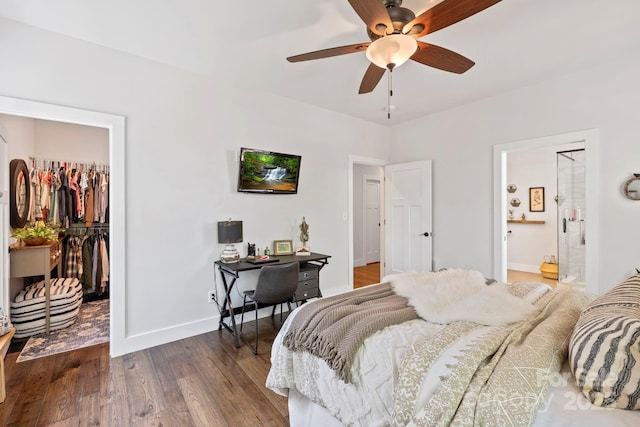 9 Oak Mountain Dr, Leicester, NC 28748 - bedroom with a spacious closet, dark wood finished floors, a closet, baseboards, and ensuite bath