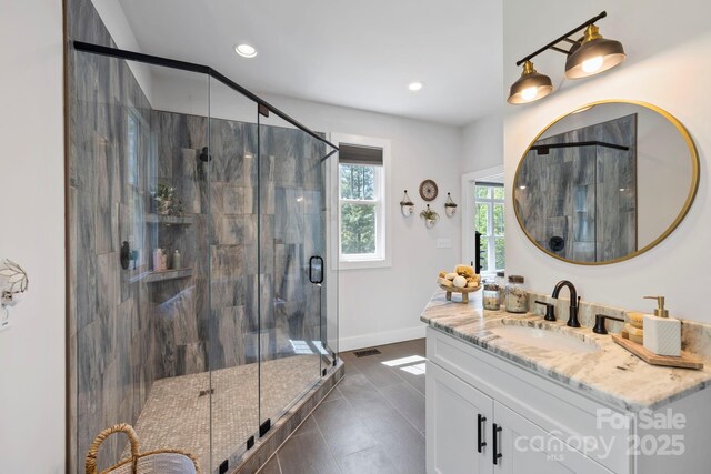 9 Oak Mountain Dr, Leicester, NC 28748 - full bath with vanity, a stall shower, recessed lighting, baseboards, and tile patterned floors