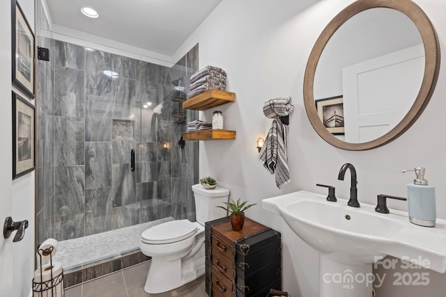 9 Oak Mountain Dr, Leicester, NC 28748 - bathroom featuring a walk in shower, toilet, tile patterned floors, recessed lighting, and a sink