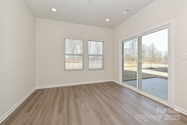 1326 31st St, Conover, NC 28613 - unfurnished room featuring recessed lighting, baseboards, visible vents, and wood finished floors