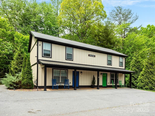 12 Martin Valley Rd, Swannanoa, NC 28778 - view of front of house featuring a porch, board and batten siding, and metal roof
