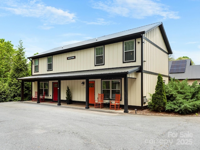 12 Martin Valley Rd, Swannanoa, NC 28778 - view of front facade with a porch, metal roof, and board and batten siding