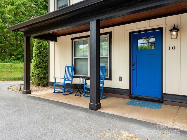 12 Martin Valley Rd, Swannanoa, NC 28778 - view of exterior entry featuring a porch and board and batten siding
