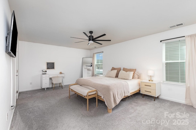 bedroom with baseboards, carpet floors, a ceiling fan, and visible vents