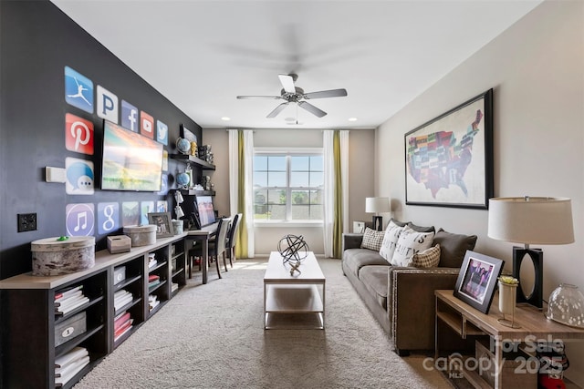 living room featuring a ceiling fan and carpet floors