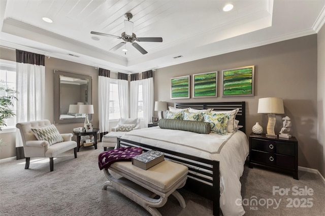 carpeted bedroom with a raised ceiling, crown molding, baseboards, a ceiling fan, and recessed lighting