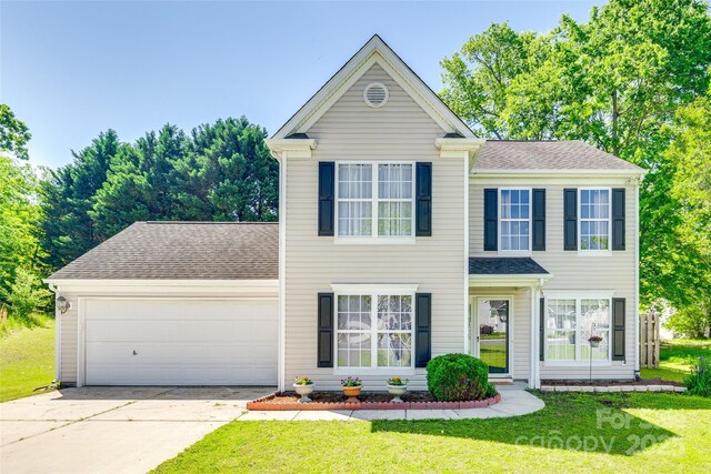 1605 Tate Rd Unit 258, Rock Hill, SC 29732 - view of front facade featuring concrete driveway, a garage, a front yard, and a shingled roof