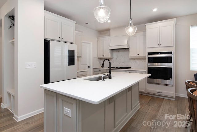 3252 Cheyney Park Dr, Charlotte, NC 28269 - kitchen with a sink, tasteful backsplash, stainless steel double oven, smart refrigerator, and light countertops