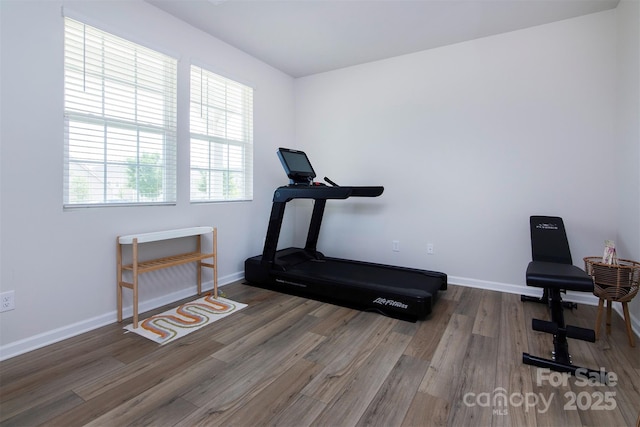 3252 Cheyney Park Dr, Charlotte, NC 28269 - workout area featuring wood finished floors and baseboards