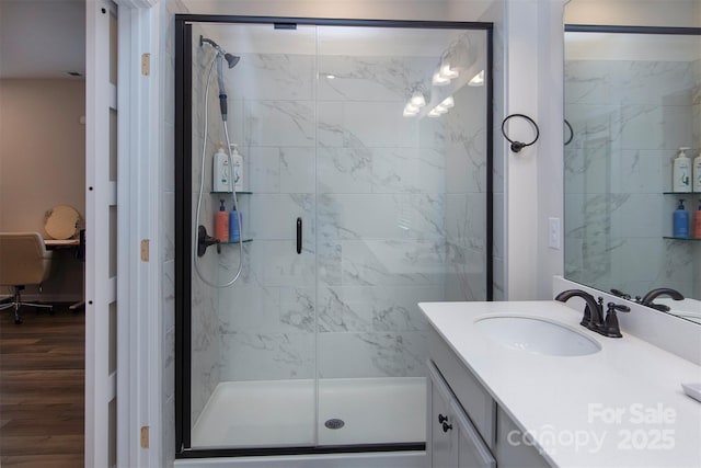 3252 Cheyney Park Dr, Charlotte, NC 28269 - bathroom with vanity, wood finished floors, and a stall shower