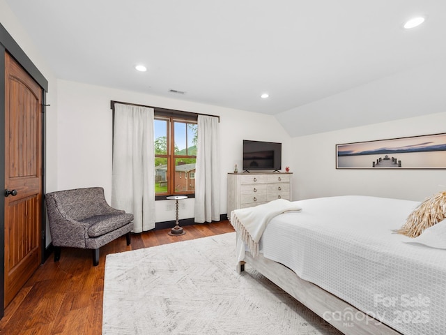 bedroom with wood finished floors, recessed lighting, and lofted ceiling
