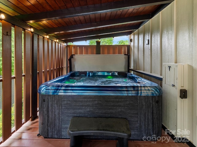 view of patio / terrace with a hot tub