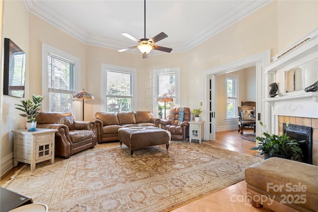 116 N Mulberry St, Statesville, NC 28677 - living room featuring healthy amount of natural light, ornamental molding, a ceiling fan, a fireplace, and baseboards