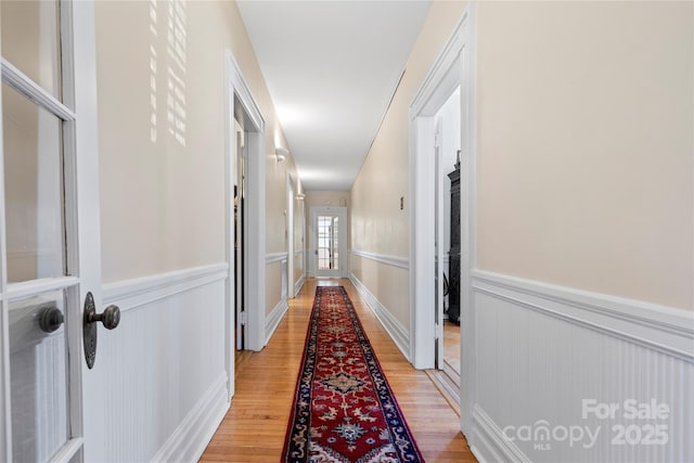 116 N Mulberry St, Statesville, NC 28677 - hall with light wood finished floors, wainscoting, and a decorative wall