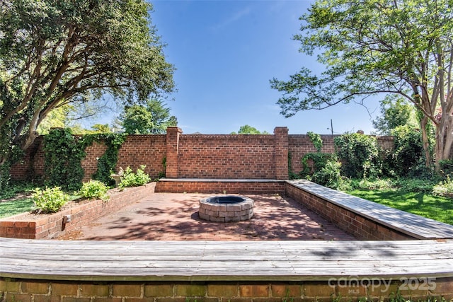 116 N Mulberry St, Statesville, NC 28677 - wooden terrace featuring an outdoor fire pit and a fenced backyard