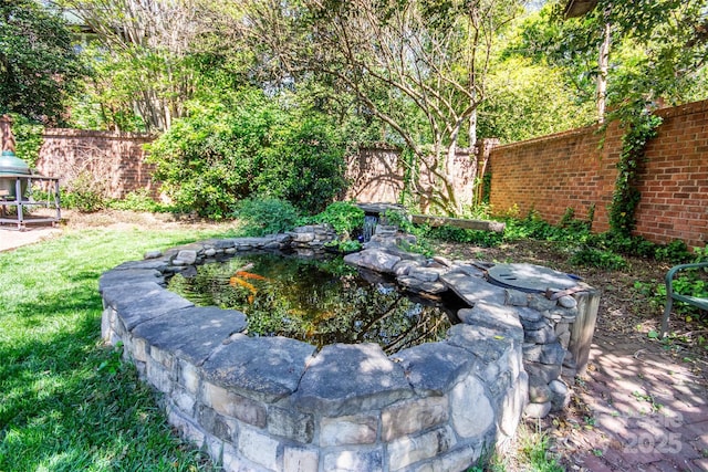 116 N Mulberry St, Statesville, NC 28677 - view of yard featuring fence and a small pond