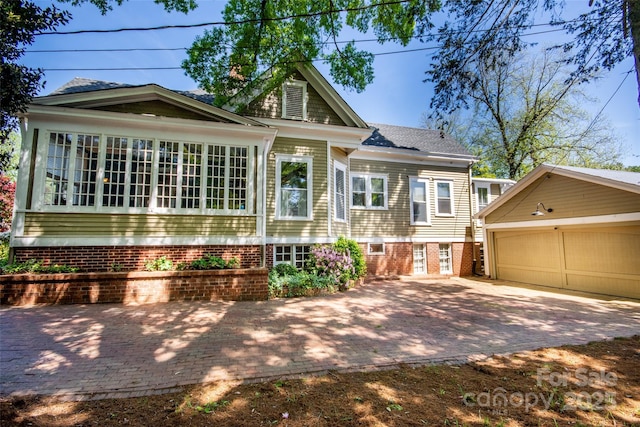 116 N Mulberry St, Statesville, NC 28677 - rear view of property featuring a garage and an outdoor structure