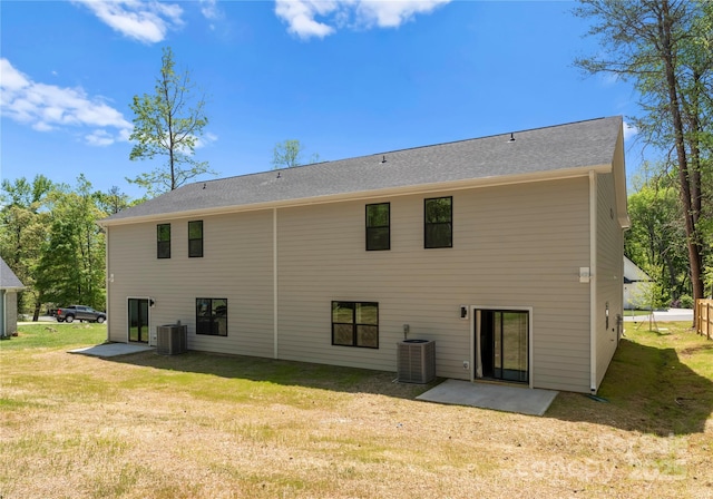 1604 Breezewood Dr, Charlotte, NC 28262 - rear view of property with a lawn and central AC unit